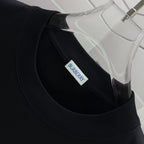 Black crew-neck T-shirt collar with stitched neckline and Burberry neck label