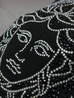 Black crewneck sweatshirt close-up of rhinestone Medusa design