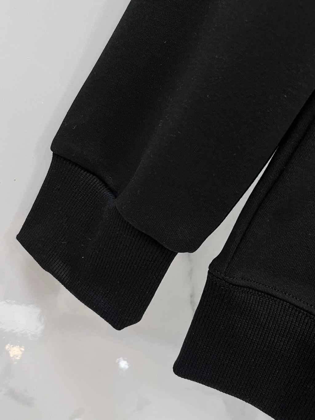 Versace black sweatshirt sleeve cuffs and ribbed hem