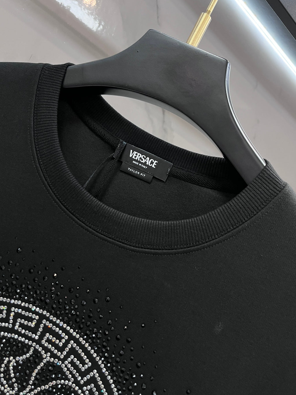 Versace black sweatshirt neckline with logo label and ribbed collar