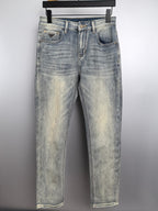 Light wash denim jeans with straight legs, front button and zip closure, belt loops
