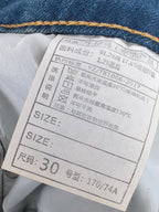 Denim jeans care and size label showing size and wash instructions