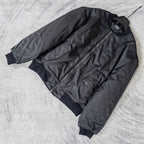 Dark bomber jacket with diagonal zip pocket detail and long sleeves