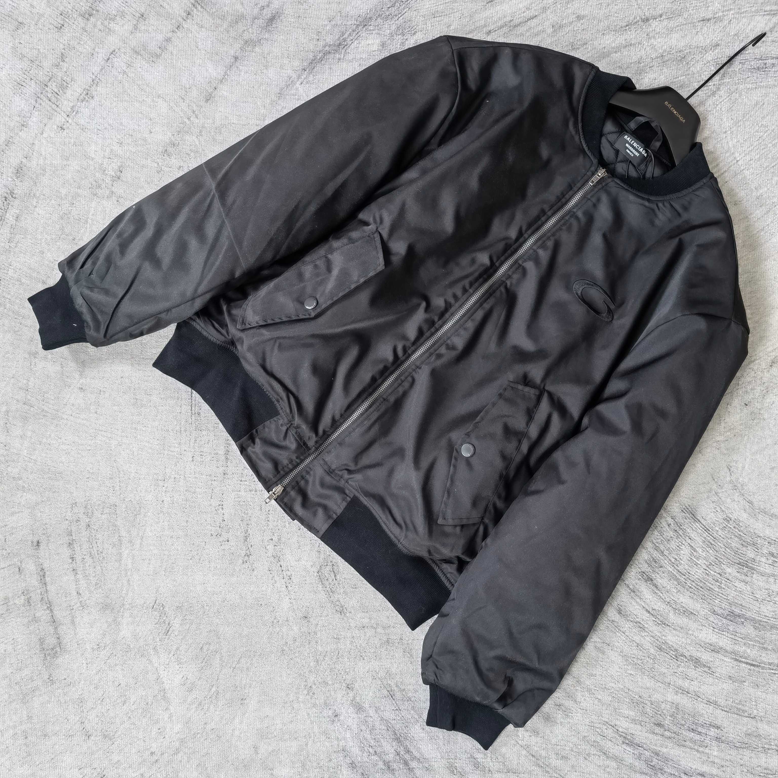 Dark bomber jacket with diagonal zip pocket detail and long sleeves