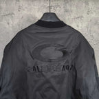Dark Balenciaga jacket with oval logo and BALENCIAGA text on the back