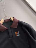 Black sweatshirt close-up with burgundy collar and F logo on chest