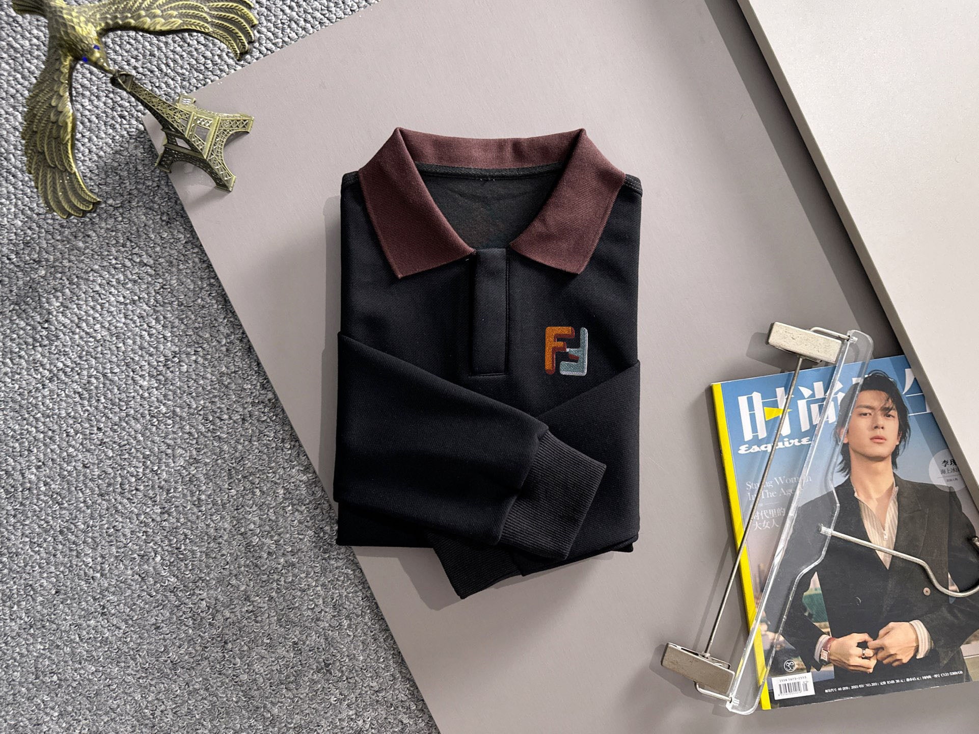Black sweatshirt with burgundy shirt-style collar and F logo on chest