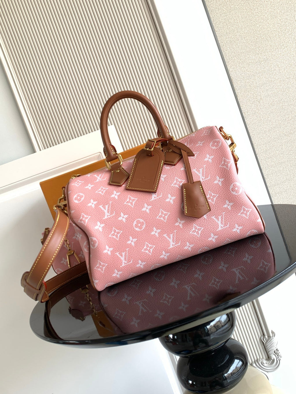 Louis Vuitton handbag in pink monogram canvas with tan leather straps and shoulder drop