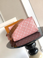Louis Vuitton pink monogram handbag with tan leather straps and front pocket tab