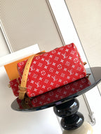 Louis Vuitton handbag red monogram print with tan leather strap and top handles