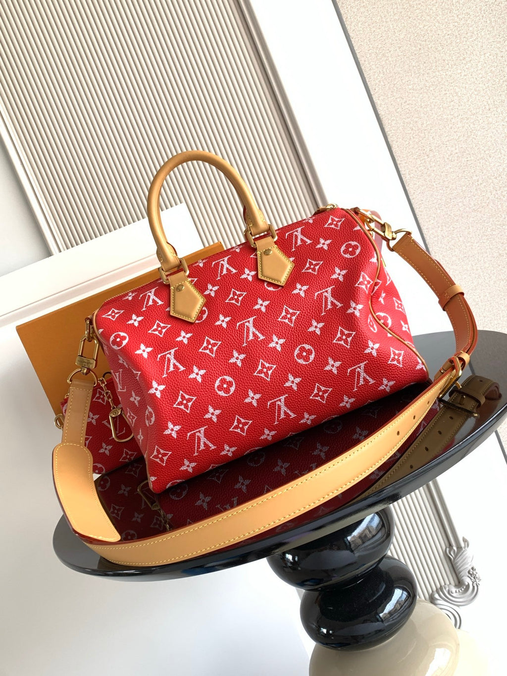 Louis Vuitton handbag red monogram print with tan leather trim and shoulder strap