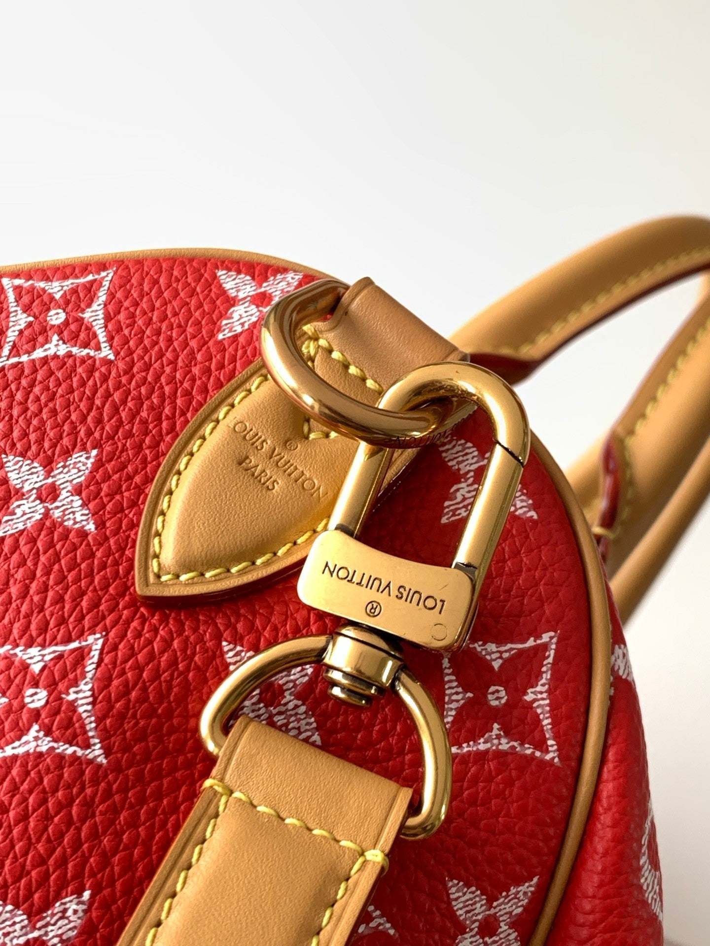 Louis Vuitton handbag red monogram with gold ring clasp and engraved luggage tag