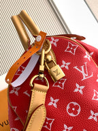 Louis Vuitton handbag red monogram with tan leather strap and gold clasp hardware