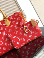 Louis Vuitton handbag red monogram print with tan strap, top handles, and luggage tag