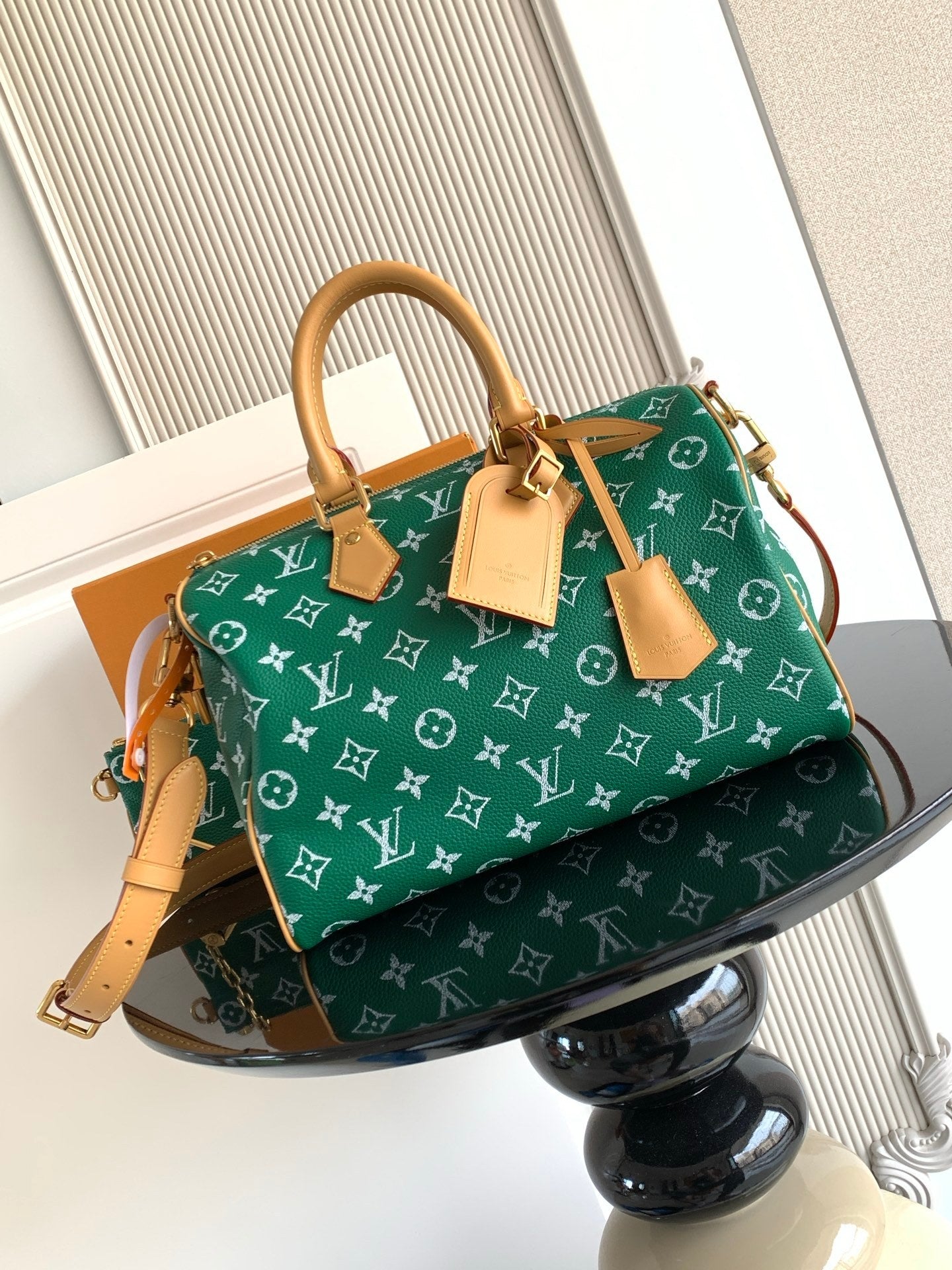 Louis Vuitton green monogram handbag with tan leather straps and side charms