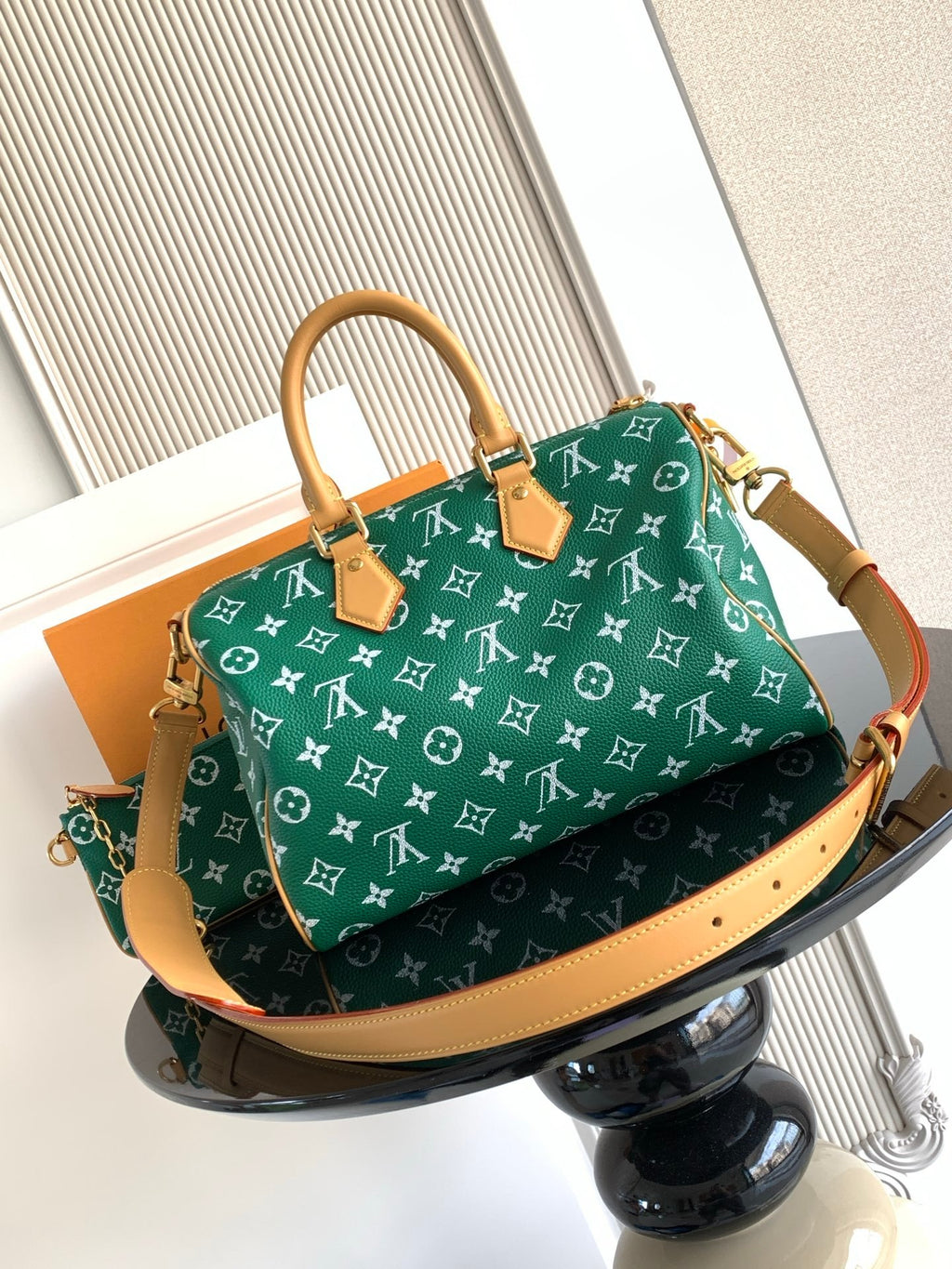 Louis Vuitton green monogram satchel with tan trim and structured top handles