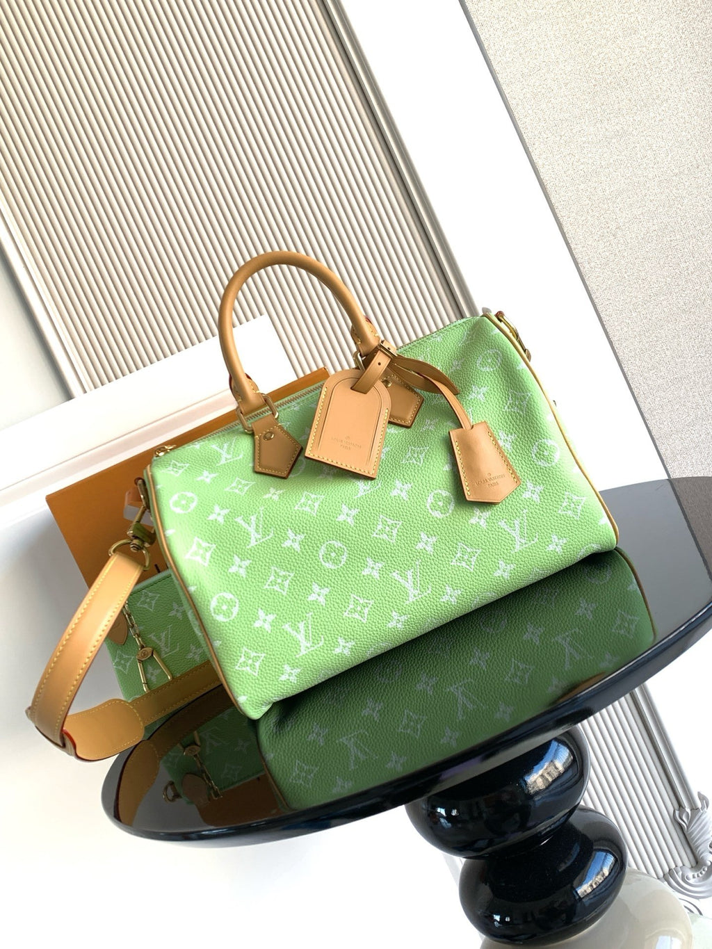 Louis Vuitton mini handbag, green monogram print with tan handles and shoulder strap