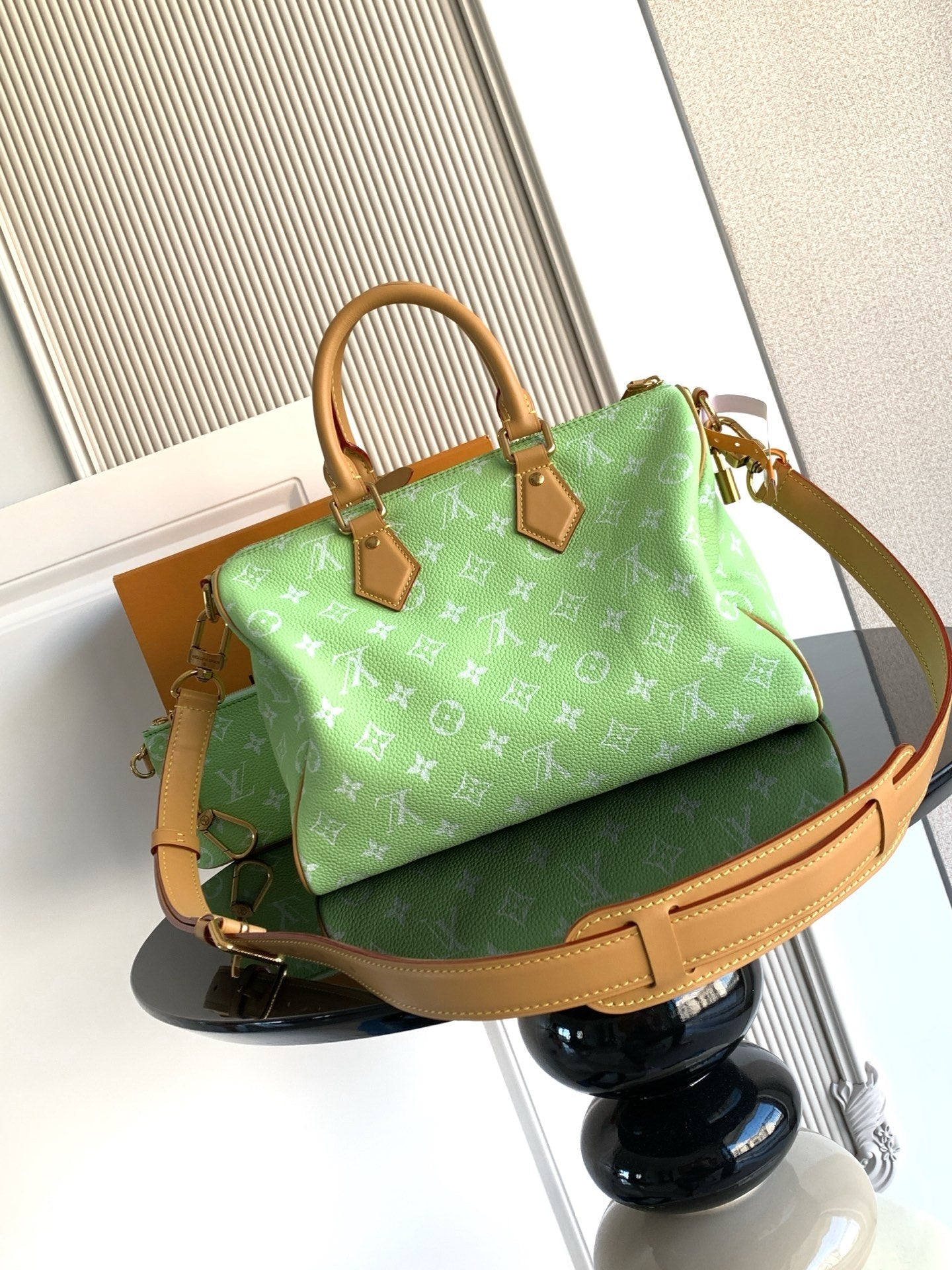 Louis Vuitton mini handbag, green monogram print with tan strap and top handle
