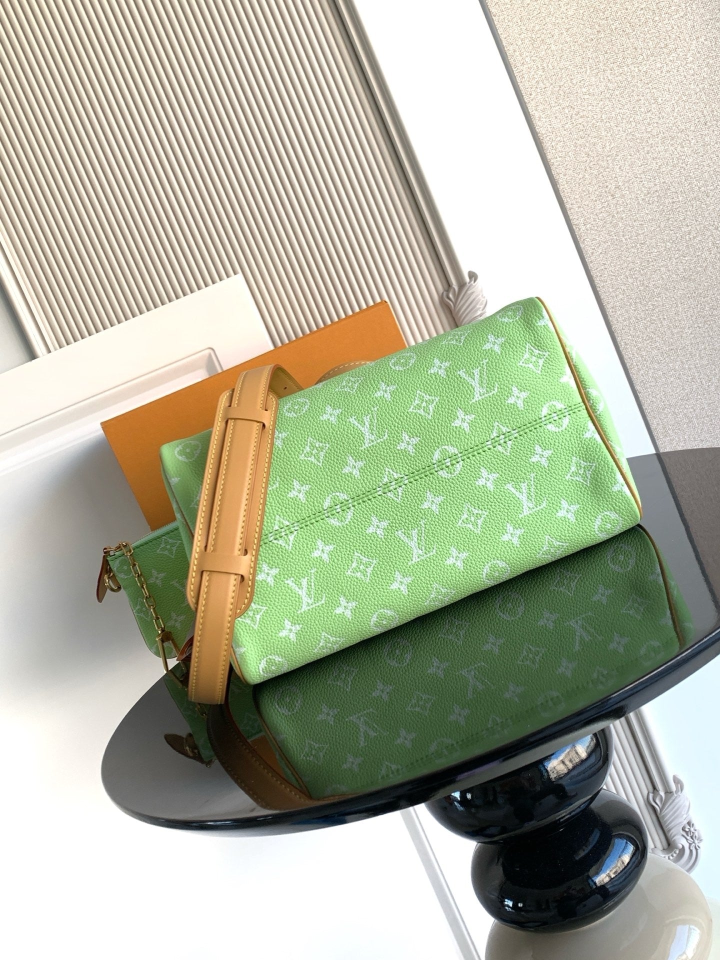 Louis Vuitton mini handbag, green monogram print with tan zipper trim and handle