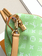 Louis Vuitton mini handbag, green monogram print with gold-tone clasp and leather strap