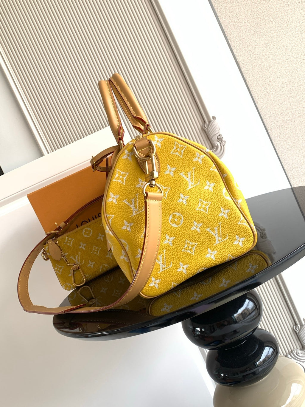 Louis Vuitton yellow monogram satchel with top handle and adjustable crossbody strap