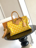 Louis Vuitton yellow monogram handbag with rolled handles, detachable strap, gold hardware