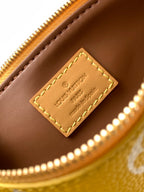 Louis Vuitton handbag tan leather label with stitched edge on gold zipper trim