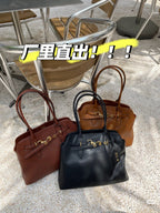 MiuMiu leather tote bags in brown and dark blue with gold hardware, styled together