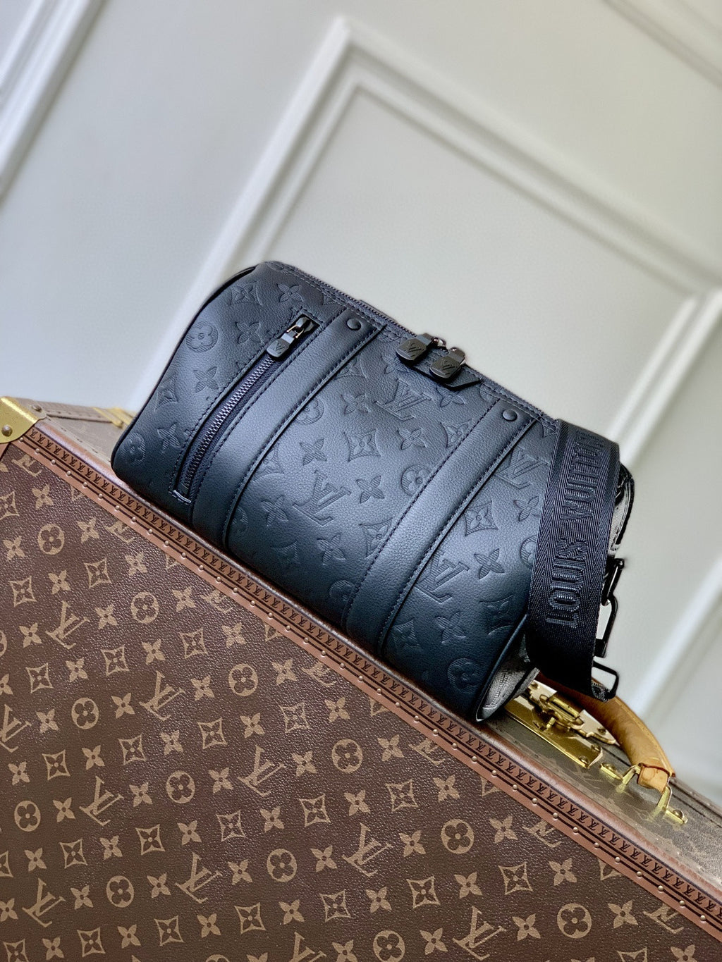 Louis Vuitton men’s crossbody bag in dark blue monogram leather with gold zipper pulls