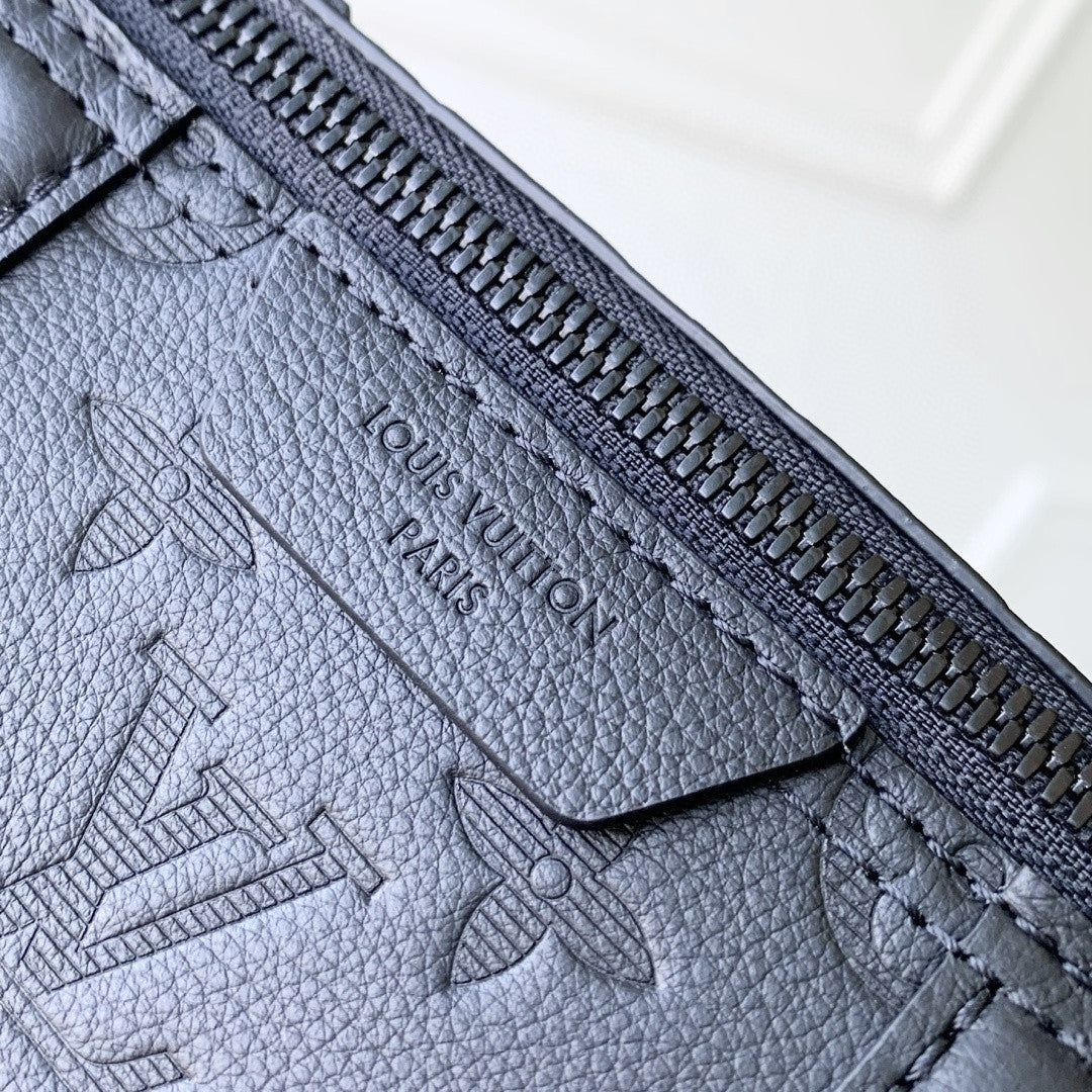 Louis Vuitton zipper edge and embossed logo on dark blue monogram leather