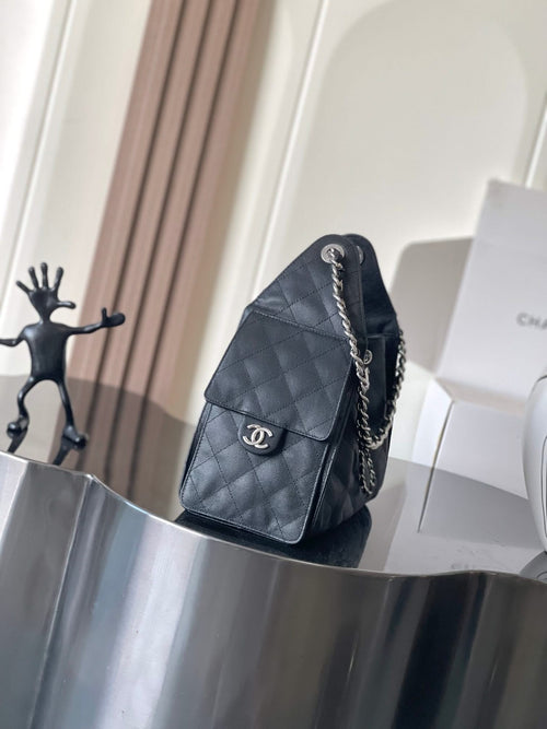 Chanel flap shoulder bag with chain strap, quilted pattern, dark color