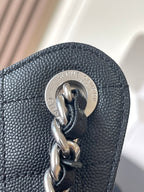 Chanel chain bag clasp with metal ring and logo medallion, dark leather