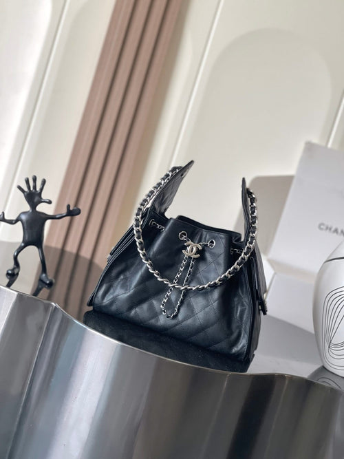 Chanel quilted bag with chain strap and top handle, dark finish