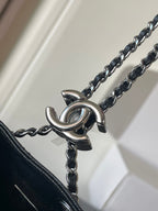 Chanel chain strap connector with metal O-ring hardware, dark bag