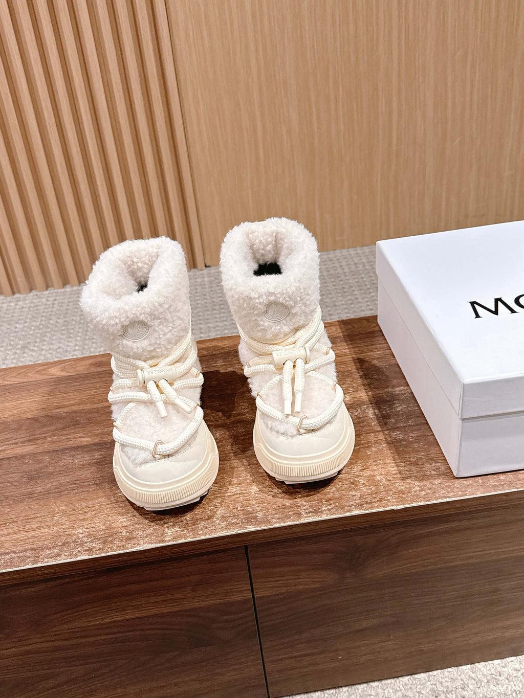 Moncler shearling ankle boots in cream with lace-up front