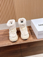 Moncler shearling ankle boots in cream with lace-up front