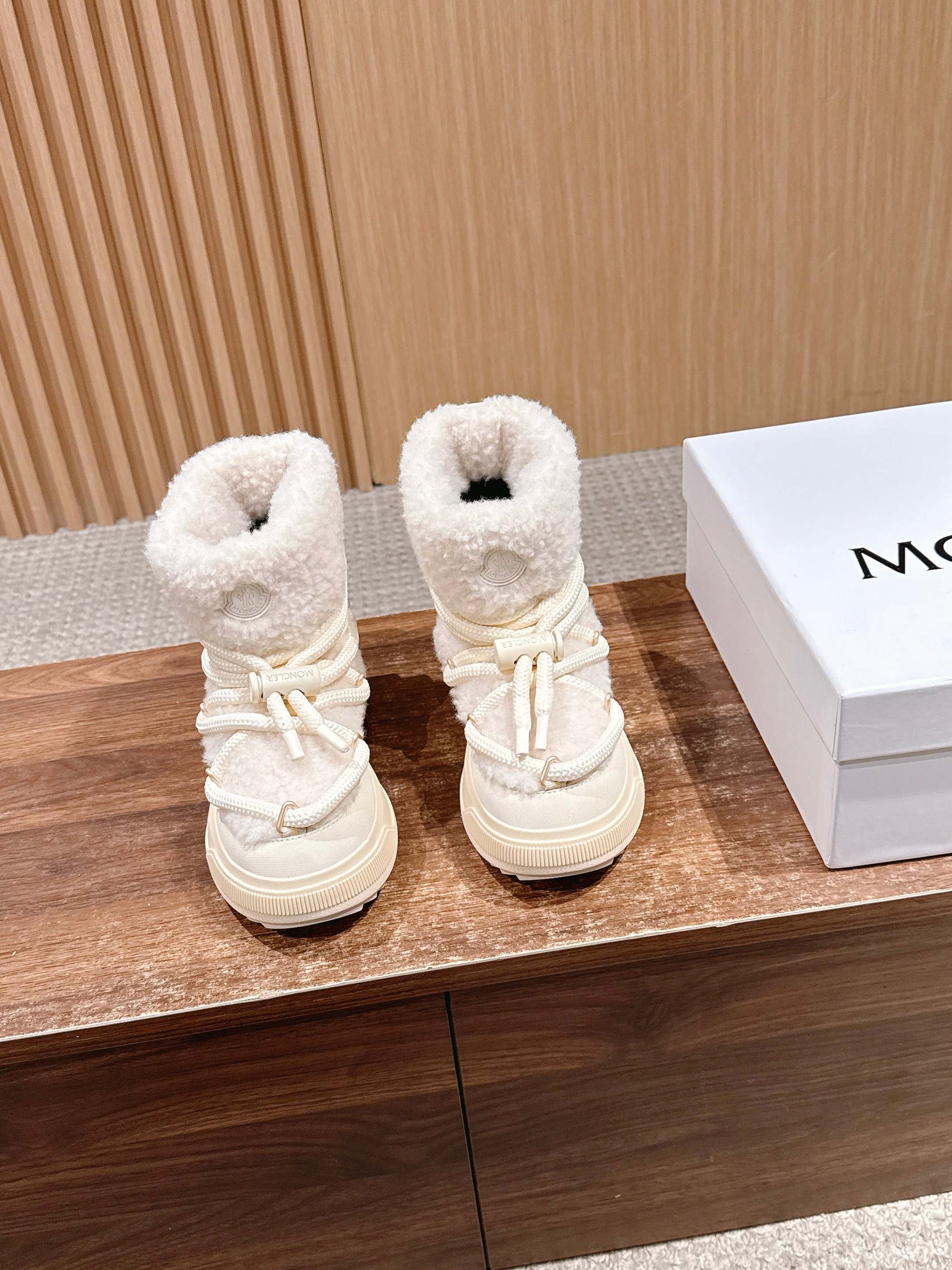 Moncler shearling ankle boots in cream with lace-up front