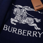 Close-up of navy knit hoodie with white graphic horse and BURBERRY lettering