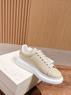 Cream alligator-embossed leather sneaker with white rubber sole and laces