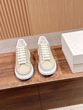 Alligator-embossed leather sneakers, cream uppers with white lace-up soles