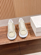 Alligator-embossed leather sneakers, cream uppers with white lace-up soles