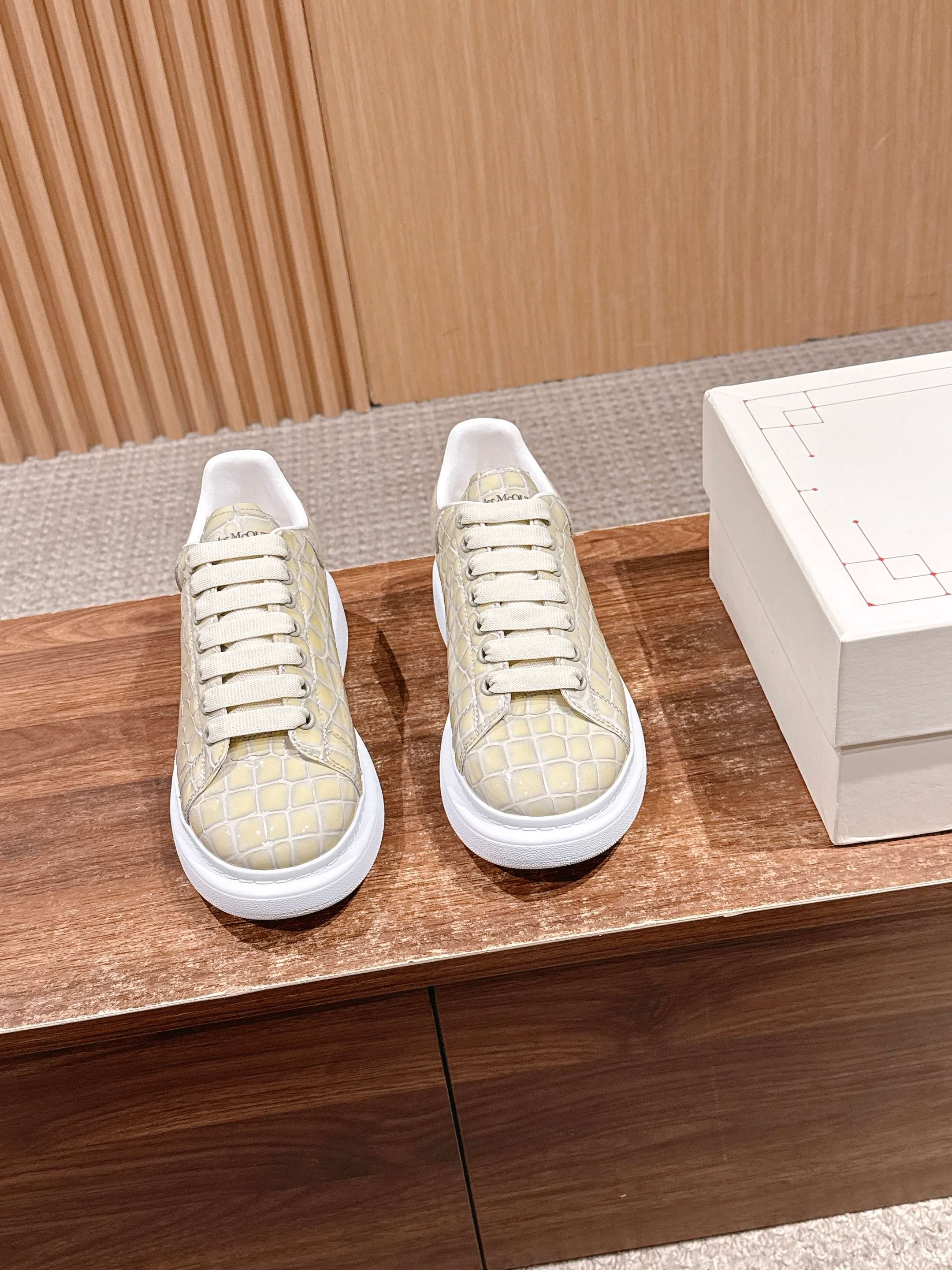 Alligator-embossed leather sneakers, cream uppers with white lace-up soles