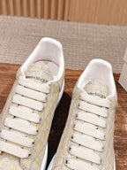 Cream alligator-embossed leather sneakers with Alexander McQueen logo on tongue