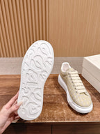 Cream alligator-embossed leather sneakers with white outsole tread