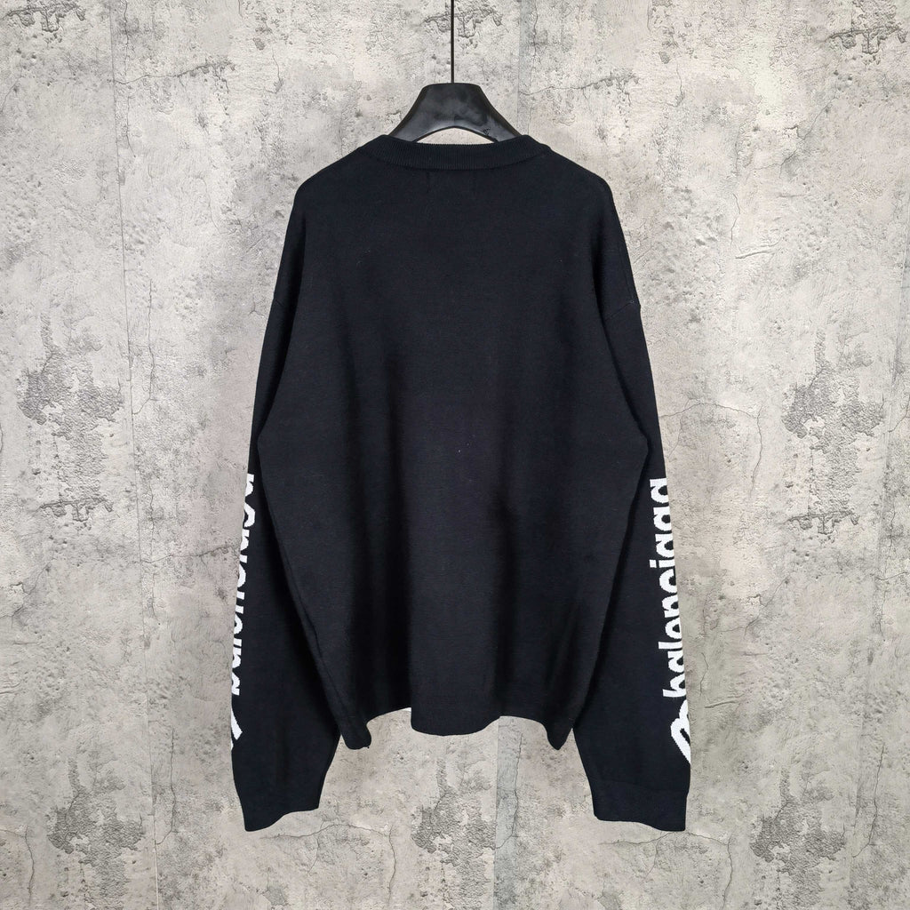 Balenciaga dark crewneck sweater, back view with sleeve logo on cuffs