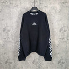 Balenciaga dark long-sleeve crewneck sweater with front logo and ribbed cuffs