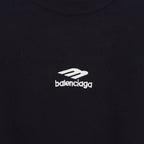 Balenciaga logo patch on dark crewneck sweater, close-up