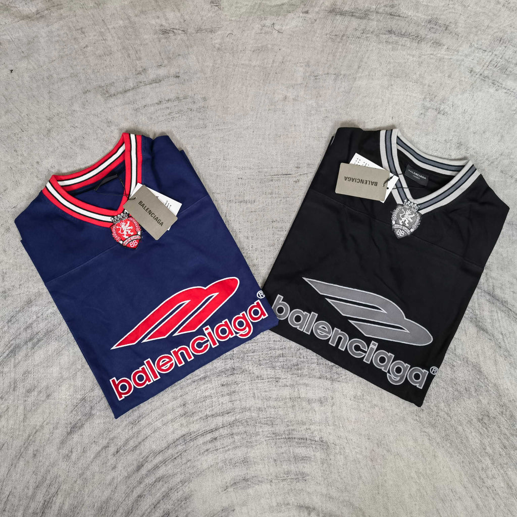 Pair of long-sleeve V-neck shirts: navy and black, each with Balenciaga logo prints.