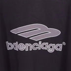 Balenciaga logo graphic close-up on black long-sleeve V-neck shirt fabric.