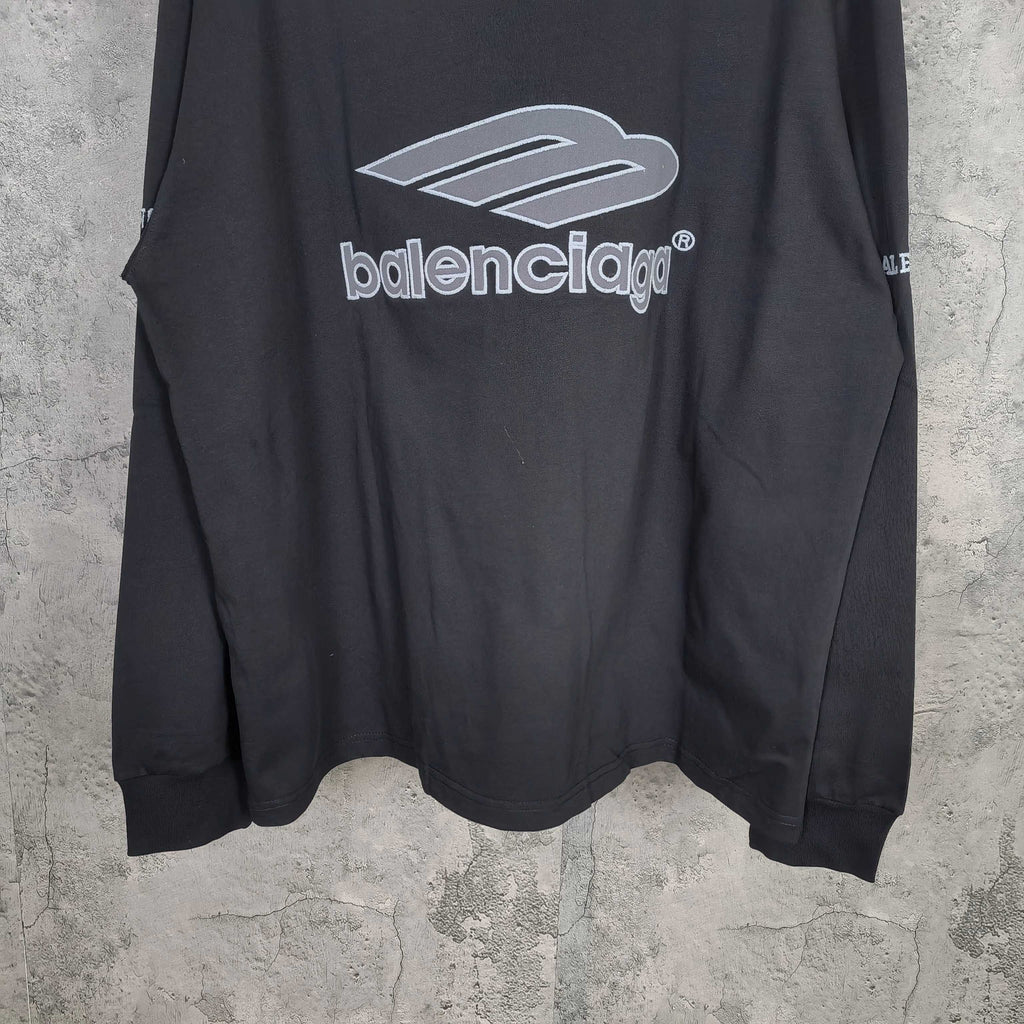 Black long-sleeve shirt with Balenciaga logo print across chest